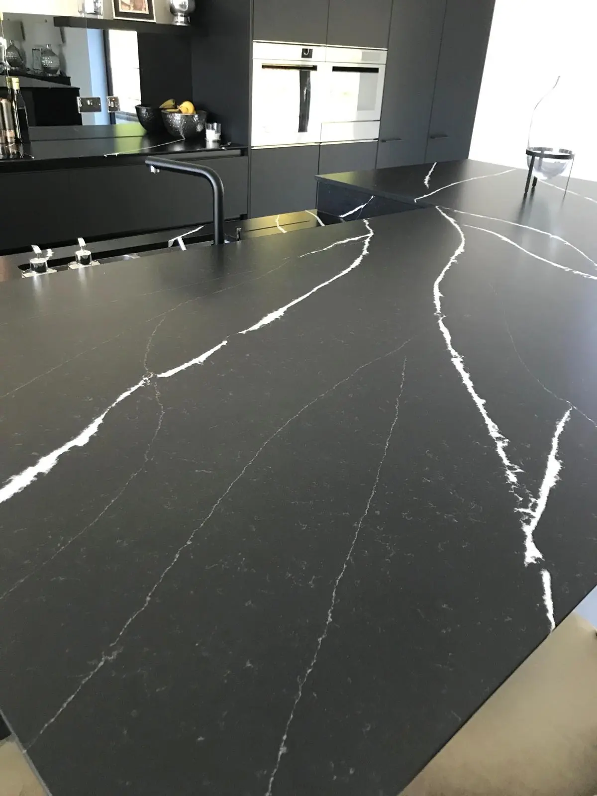 Black marble worktop with dramatic white veining