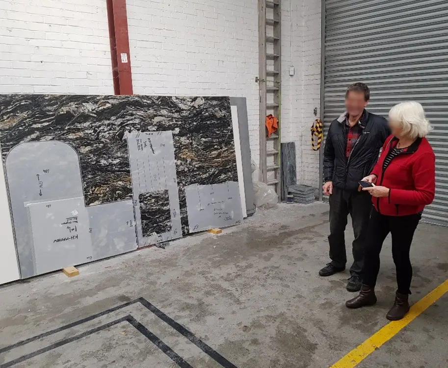 Couple choosing a marble slab for their kitchen