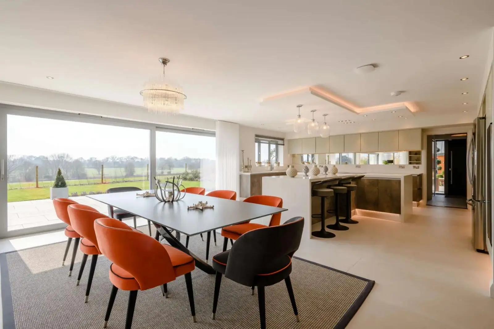 Open plan kitchen and dining space with stone worktops fitted by The Marble Works