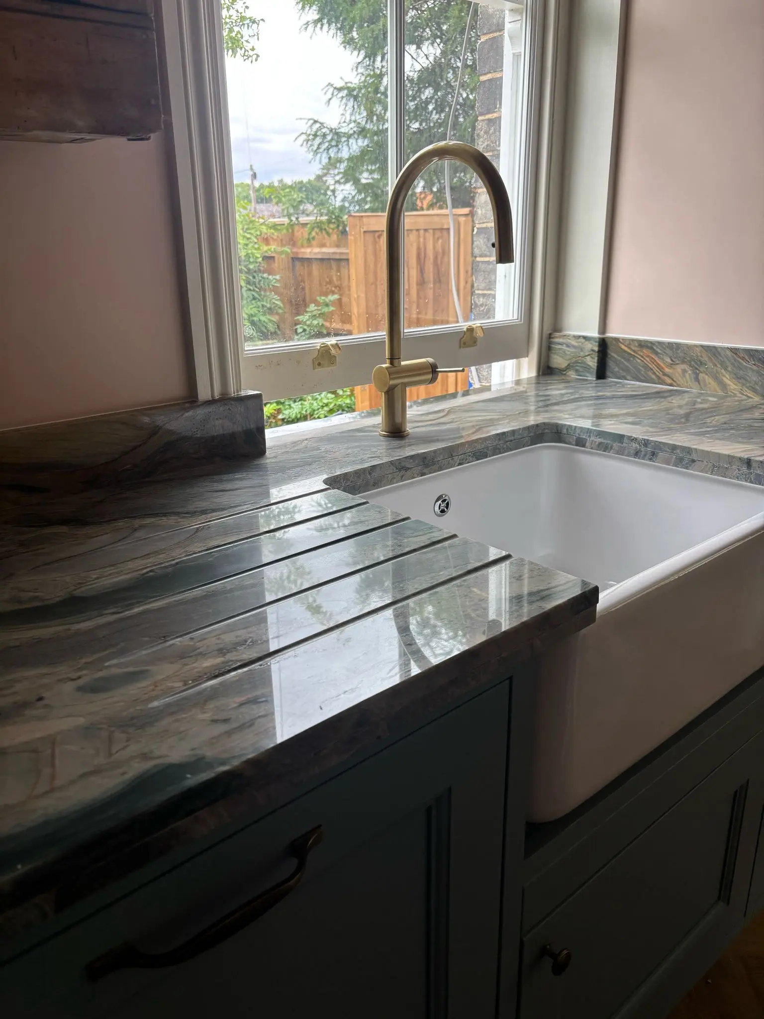 Stone kitchen worktop with an undermounted sink cut-out