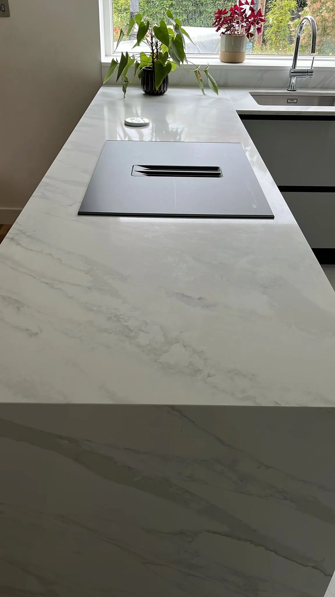 Long marble worktop run in a Norwich kitchen