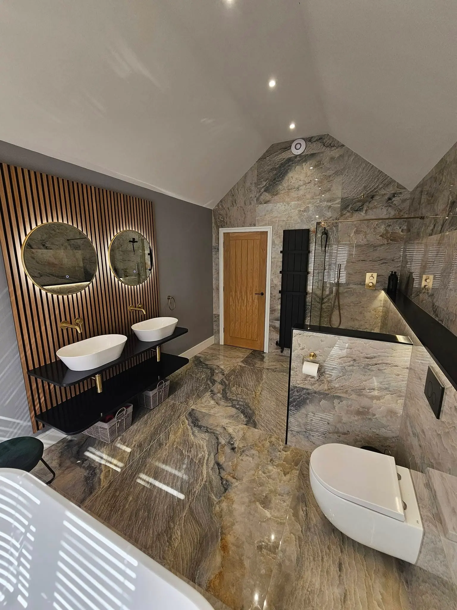 Bathroom with brown marble floor and wall surfaces