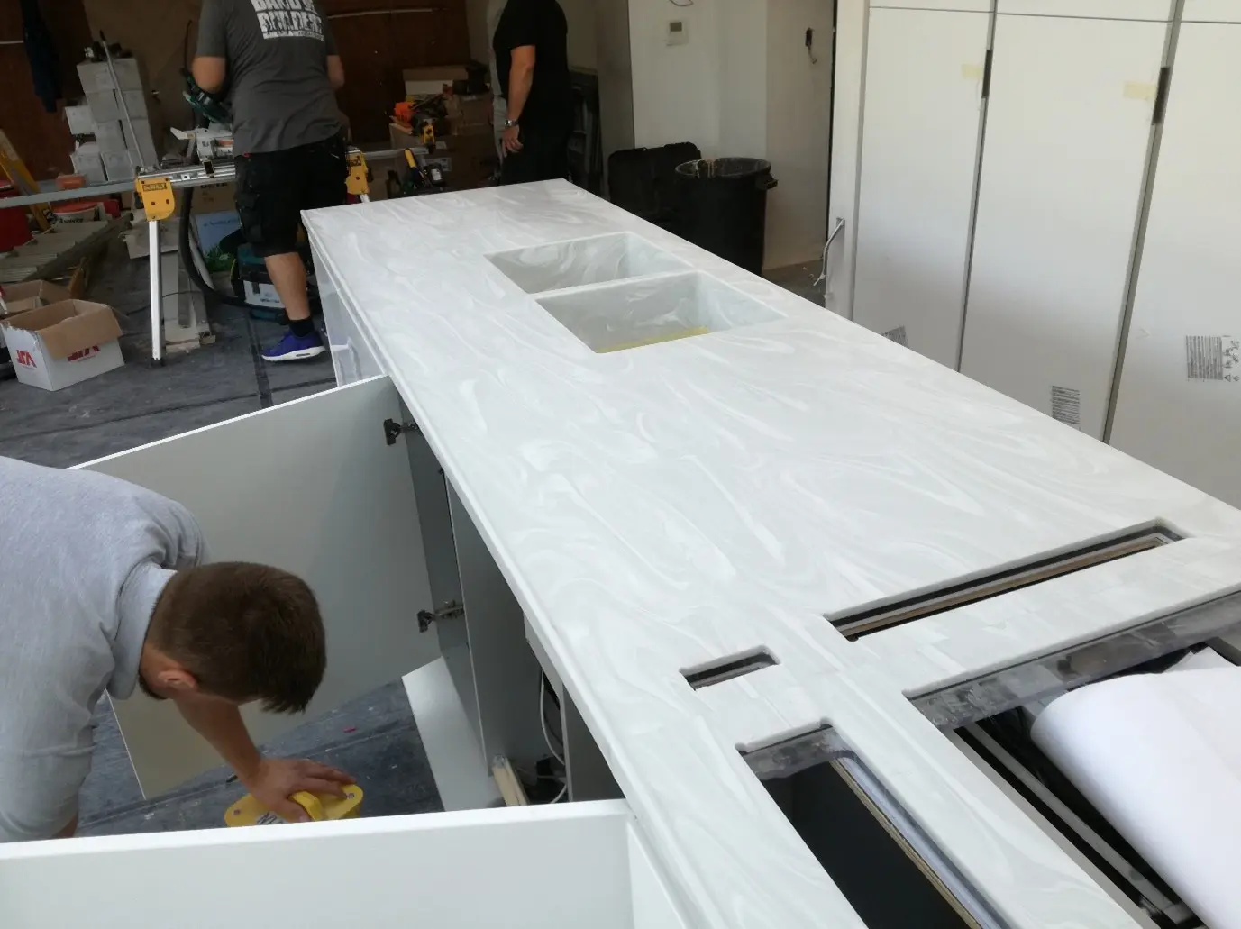 The Marble Works team fitting a stone counter