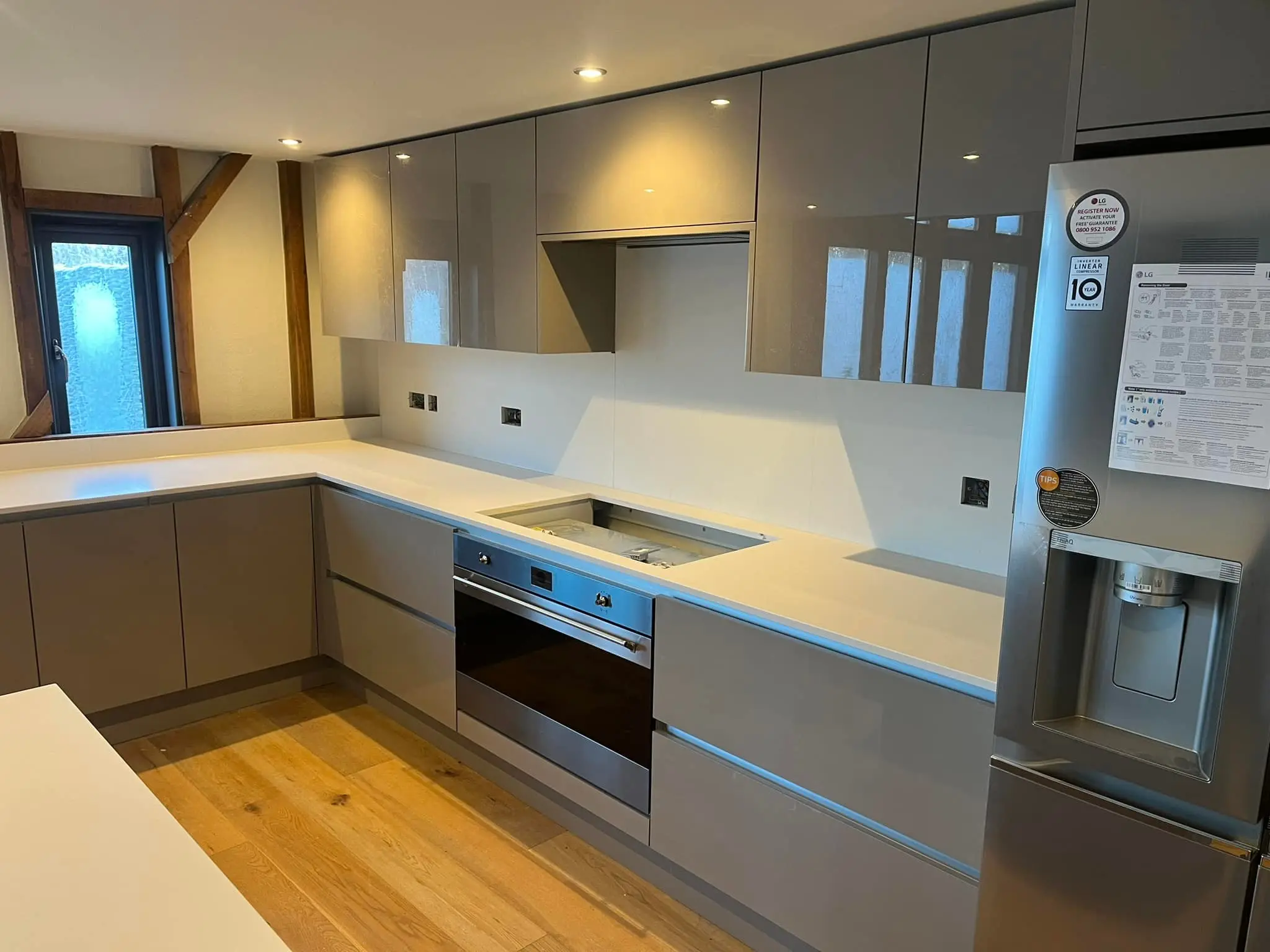 Sleek modern kitchen with white granite counters