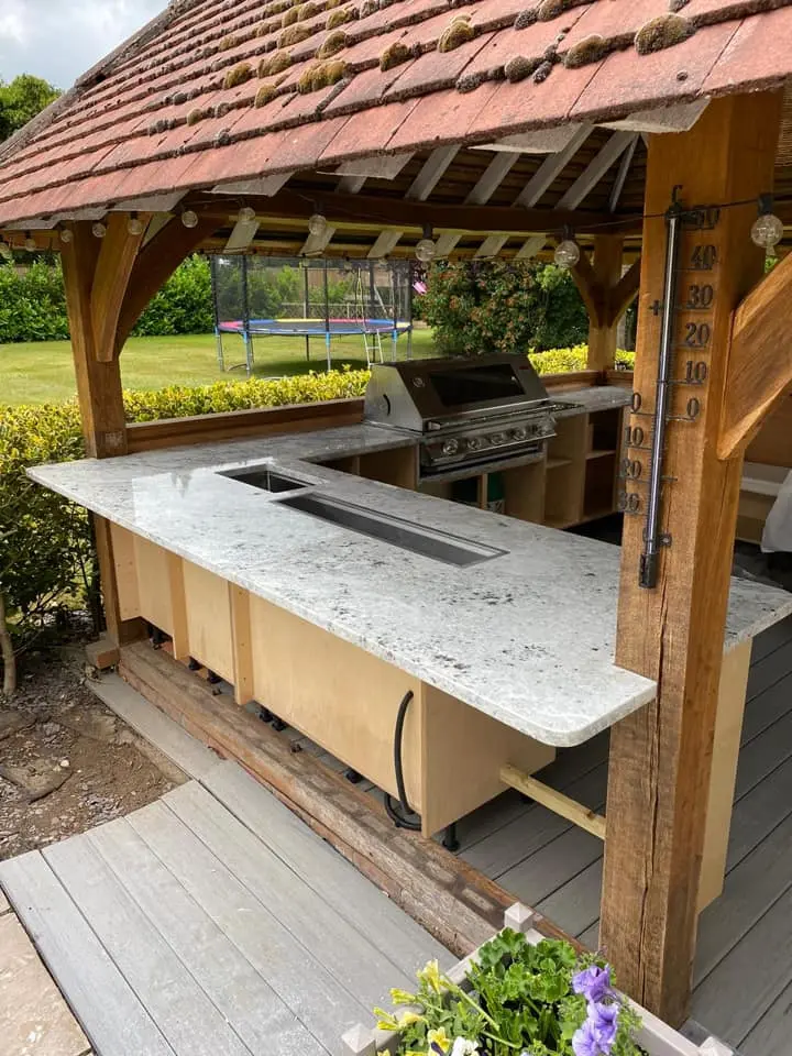 Outdoor barbecue area with a marble worktop