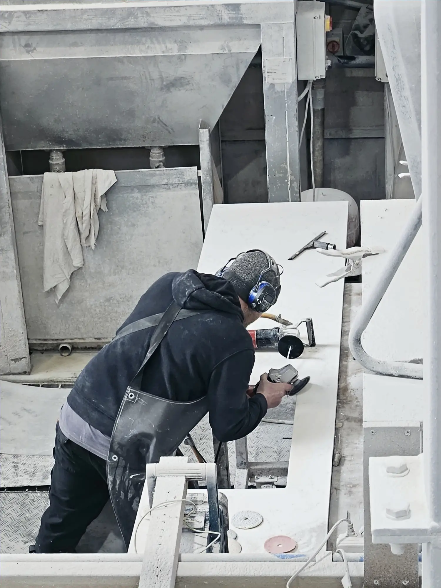White marble slab being cut in the Ipswich workshop