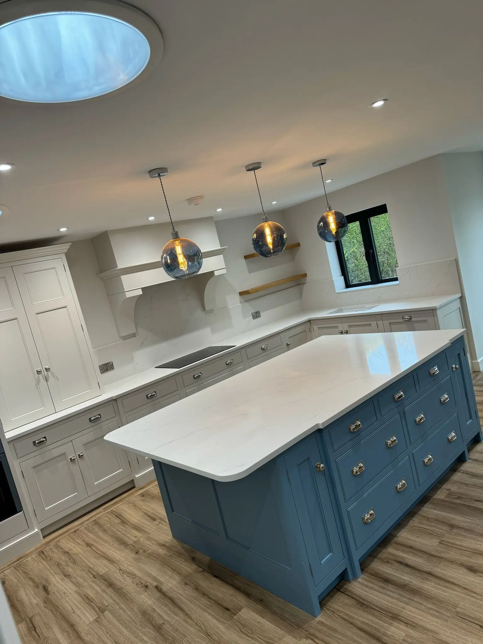 White marble kitchen worktops with island seating